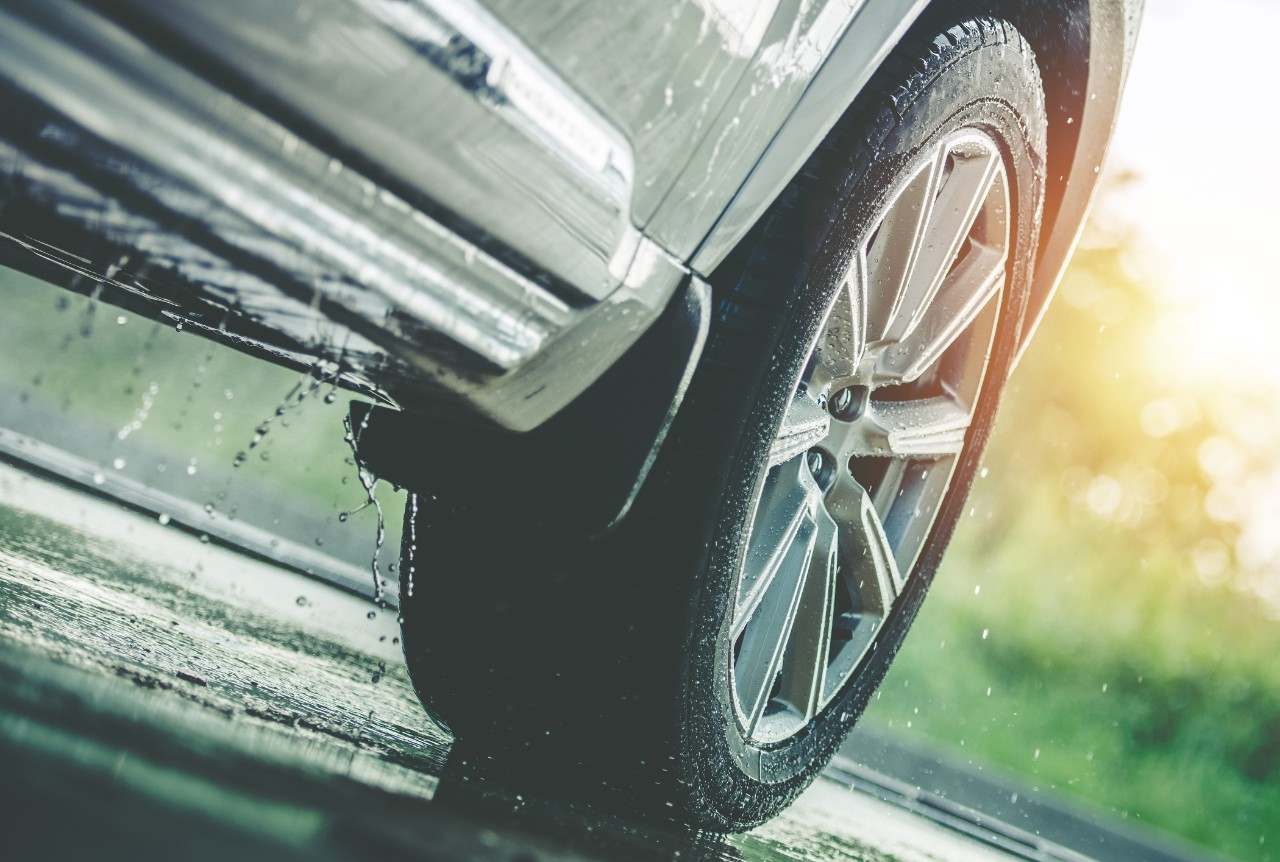 Car Driving Through Water Close-Up