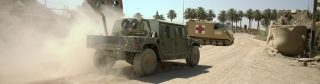 Stock Photography: iStock-182177784.jpg U.S. HMMWV kicking up dust in Iraq.