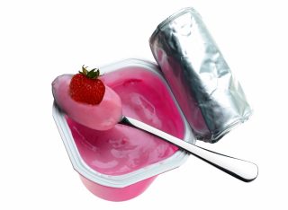 Stock Photography: iStock_000005951396Large_wstrawberry_97929310 Yogurt in plastic box on white background