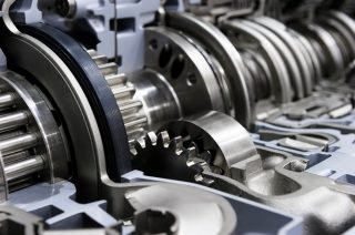 Gearbox cross-section, automotive transmission with sprocket and bearing mechanism for commercial trucks, SUV, cargo, and construction vehicles, selective focus 