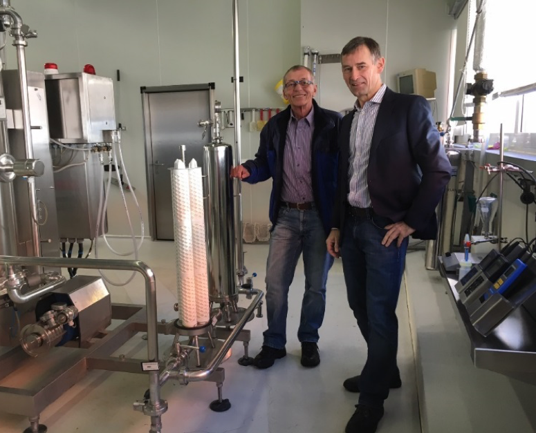 Figure 2: Karl Sickau, Director Lebensgutquelle (left), with Donaldson Sales Engineer Thomas Karollus close to the bottling line.